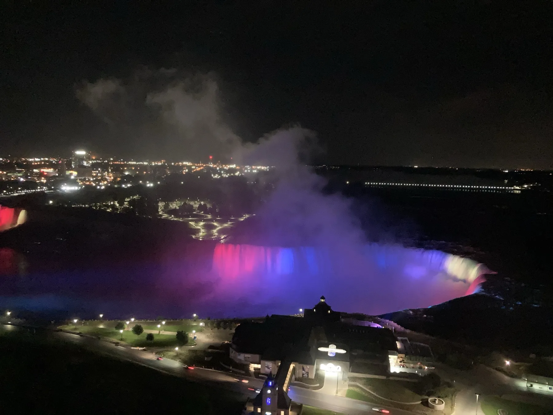 Night view of Niagara Falls with coloured lights