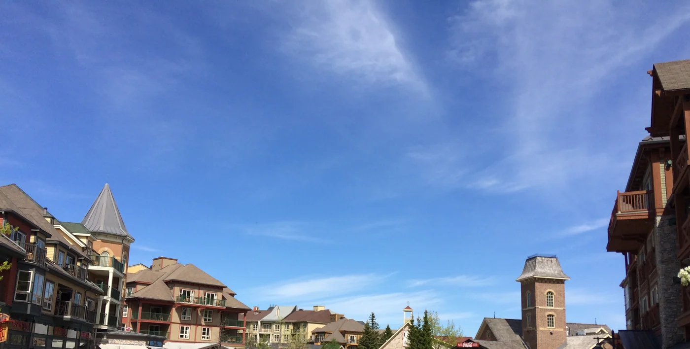Blue Mountain Village rooftops and resort architecture under a blue sky
