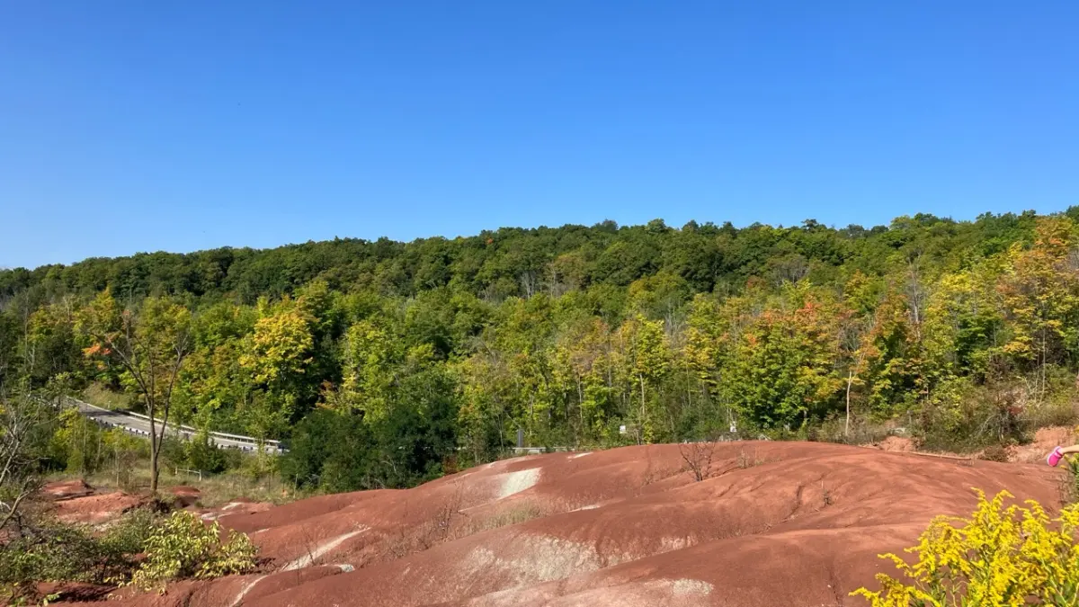 Wide view of red shale hills at Cheltenham Badlands in Caledon Ontario