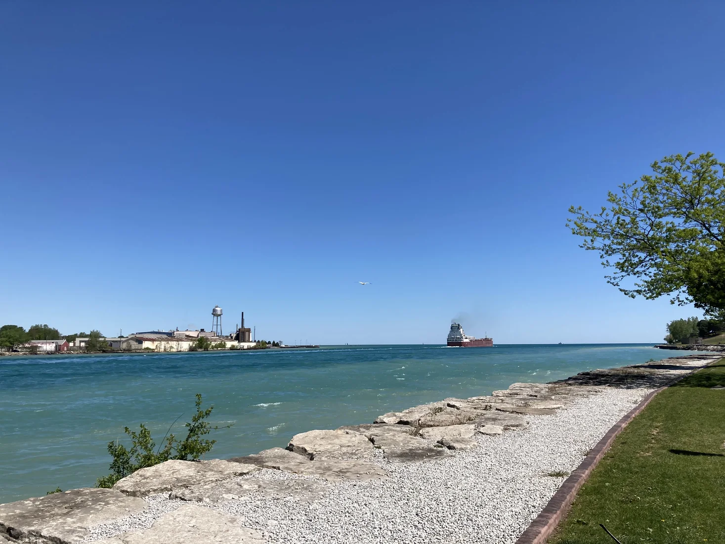 Ship and Port Huron waterfront across the blue water from Point Edward