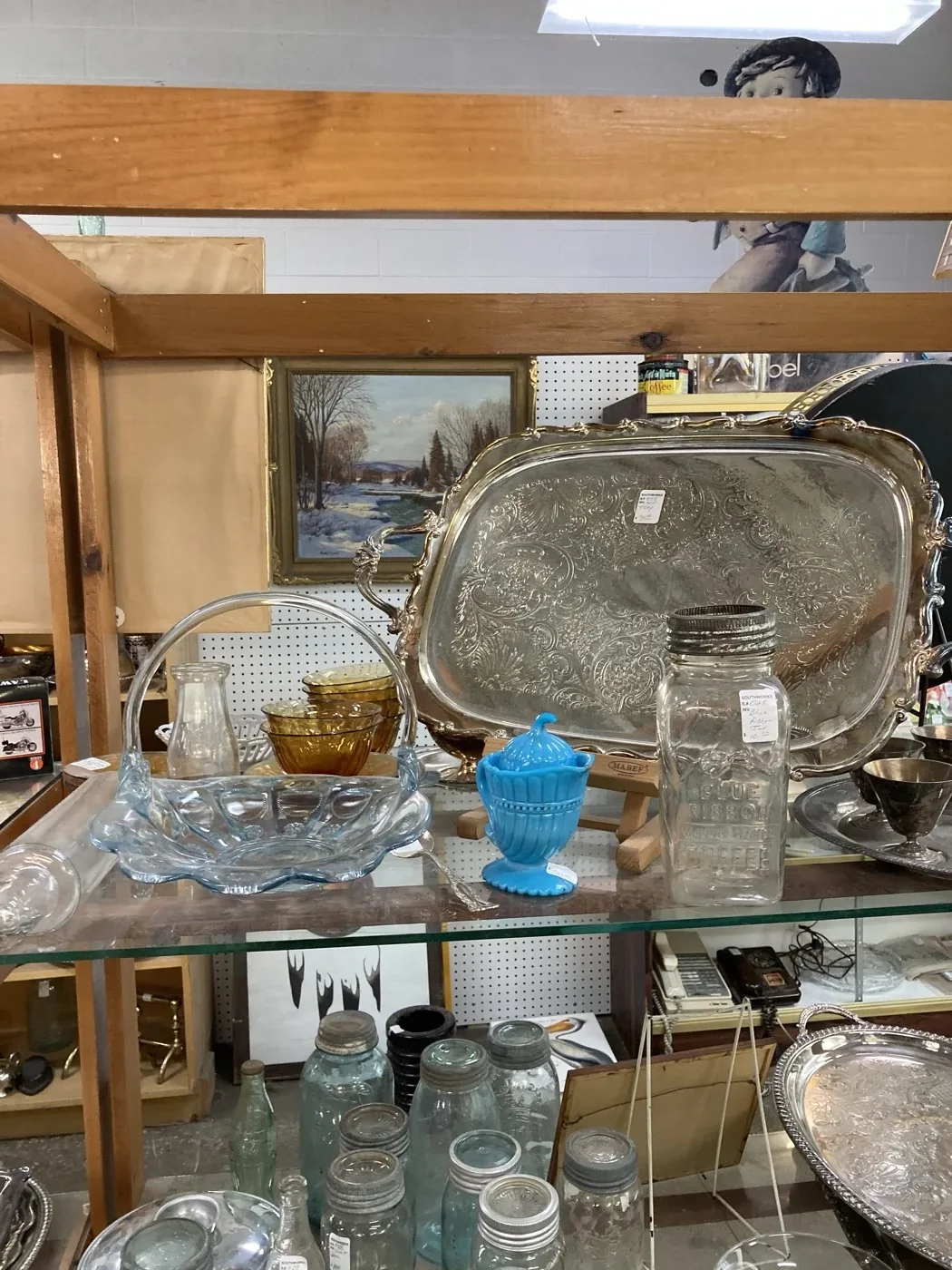 Glassware, jars and a silver-toned serving tray on display at Southworks Antiques in Cambridge