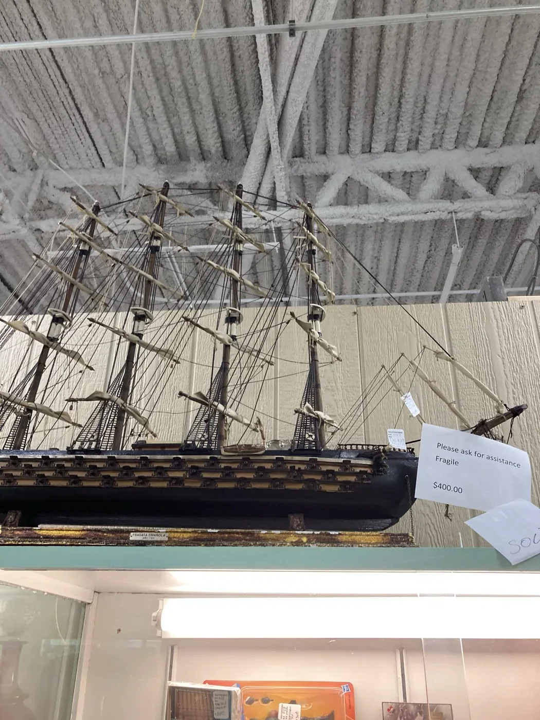 Detailed vintage model sailing ship on display at Southworks Antiques in Cambridge