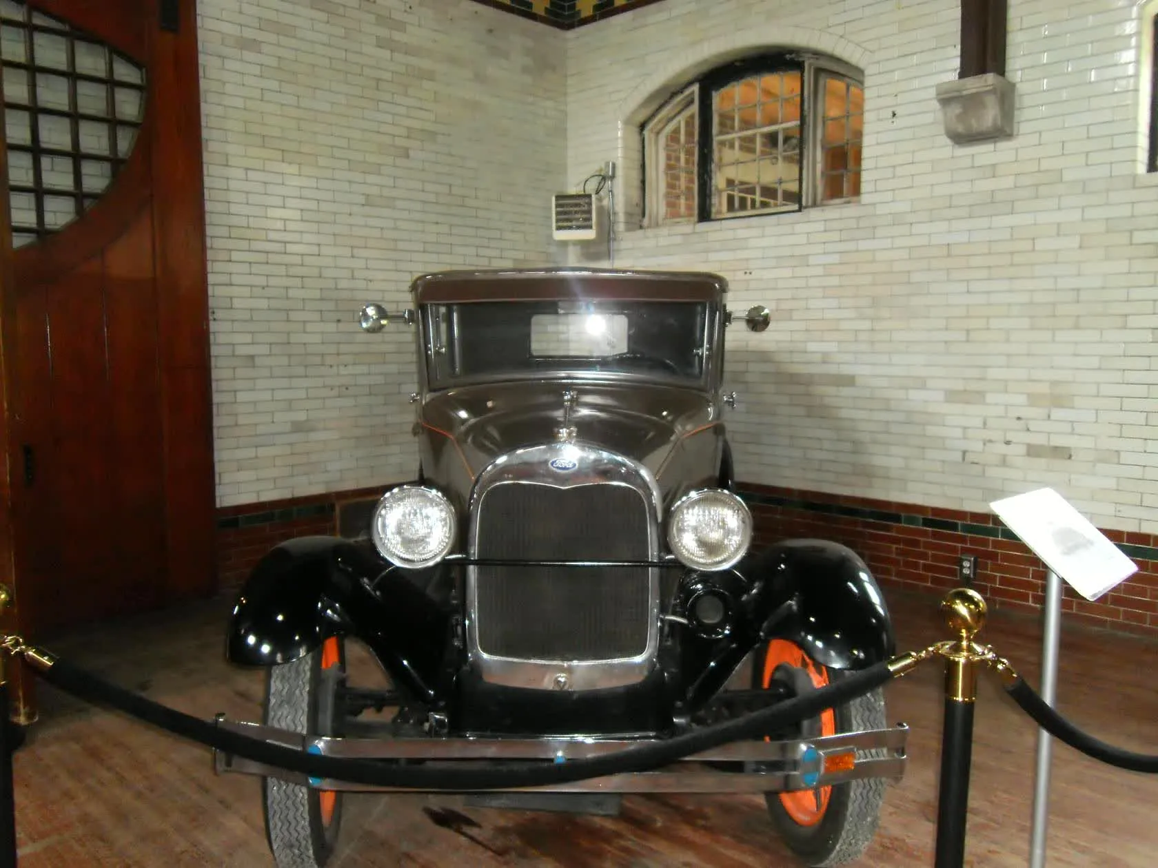 Front view of a vintage car in Casa Loma's lower level
