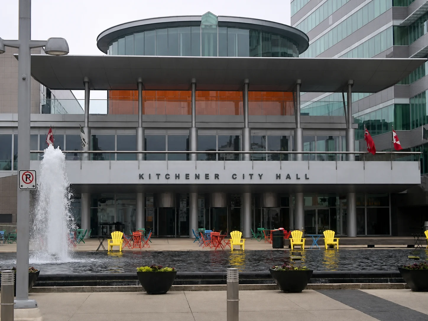 Kitchener City Hall civic plaza with fountain and colourful chairs in downtown Kitchener Ontario