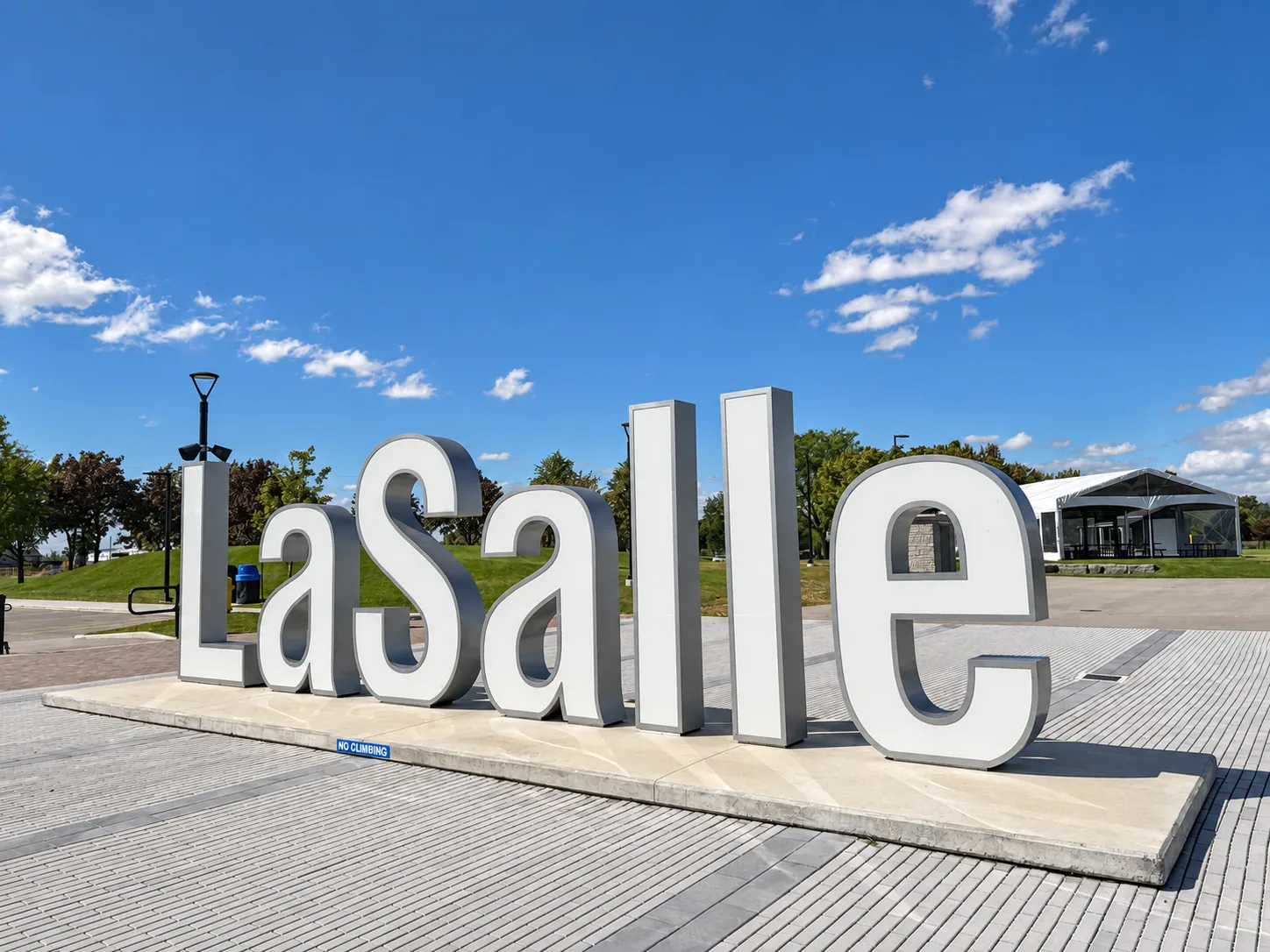 The large LaSalle landmark sign on the waterfront plaza; do not climb the letters.