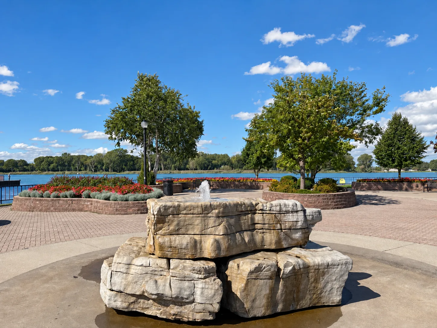 Stone fountain and planted beds beside the Detroit River in LaSalle.