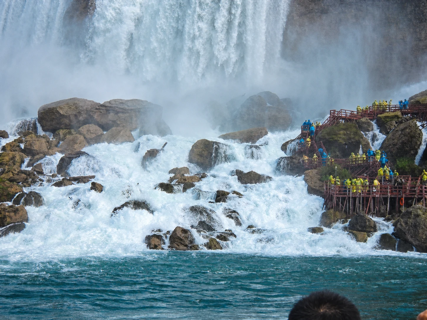Misty Niagara Falls basin with the stairs and viewing decks
