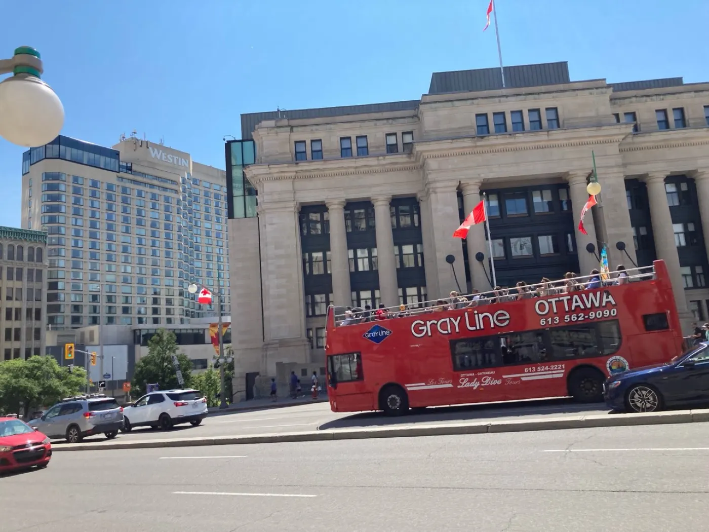 Red Gray Line Ottawa Lady Dive sightseeing bus in downtown Ottawa