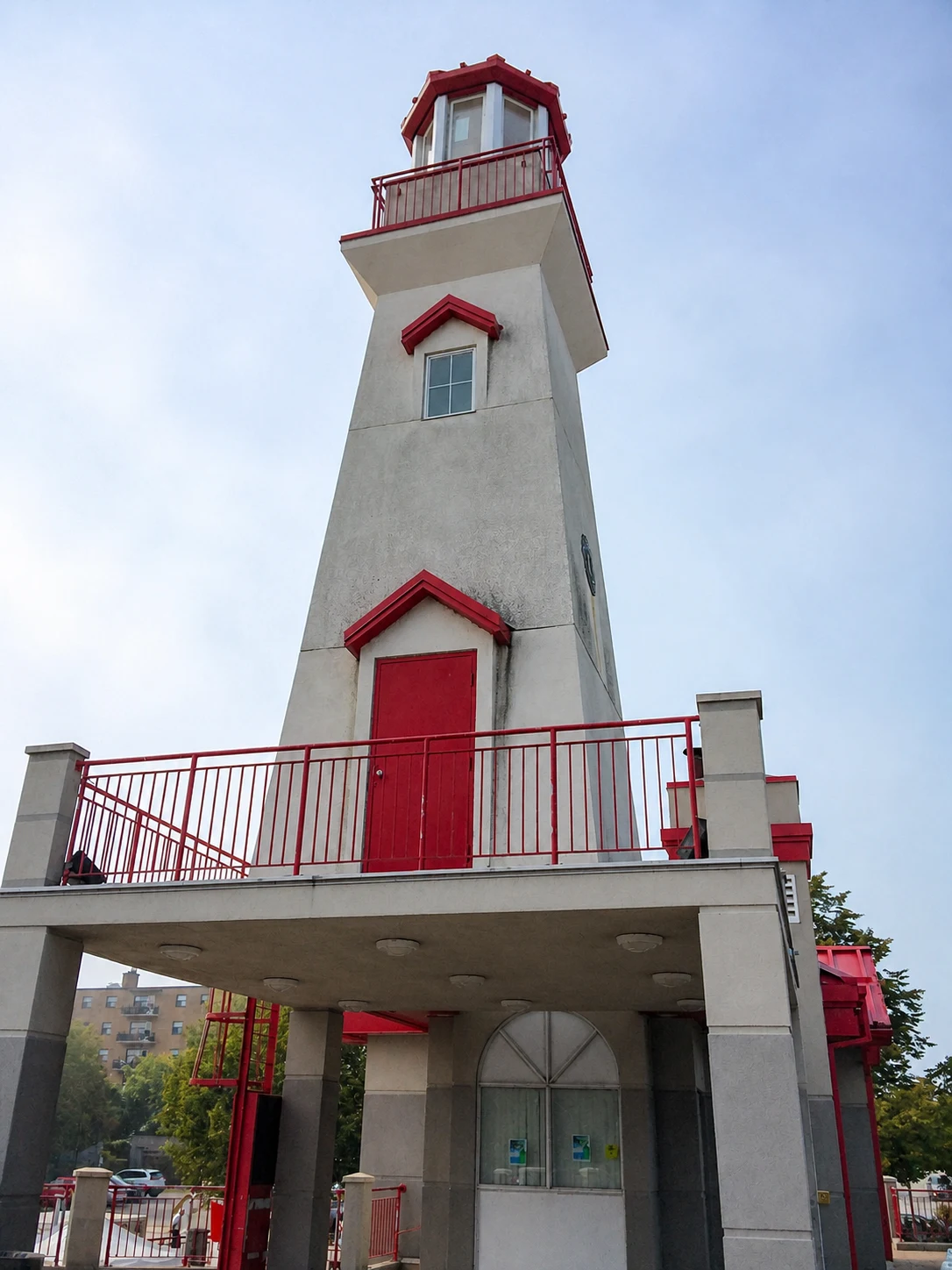 White and red Port Credit lighthouse viewed from below