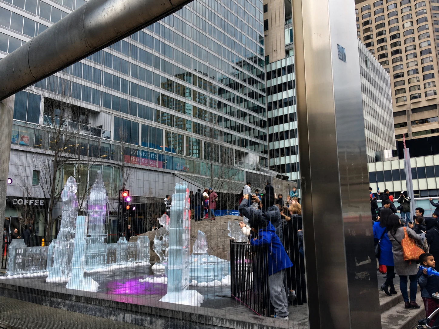Crowds photographing ice sculptures in Village of Yorkville Park